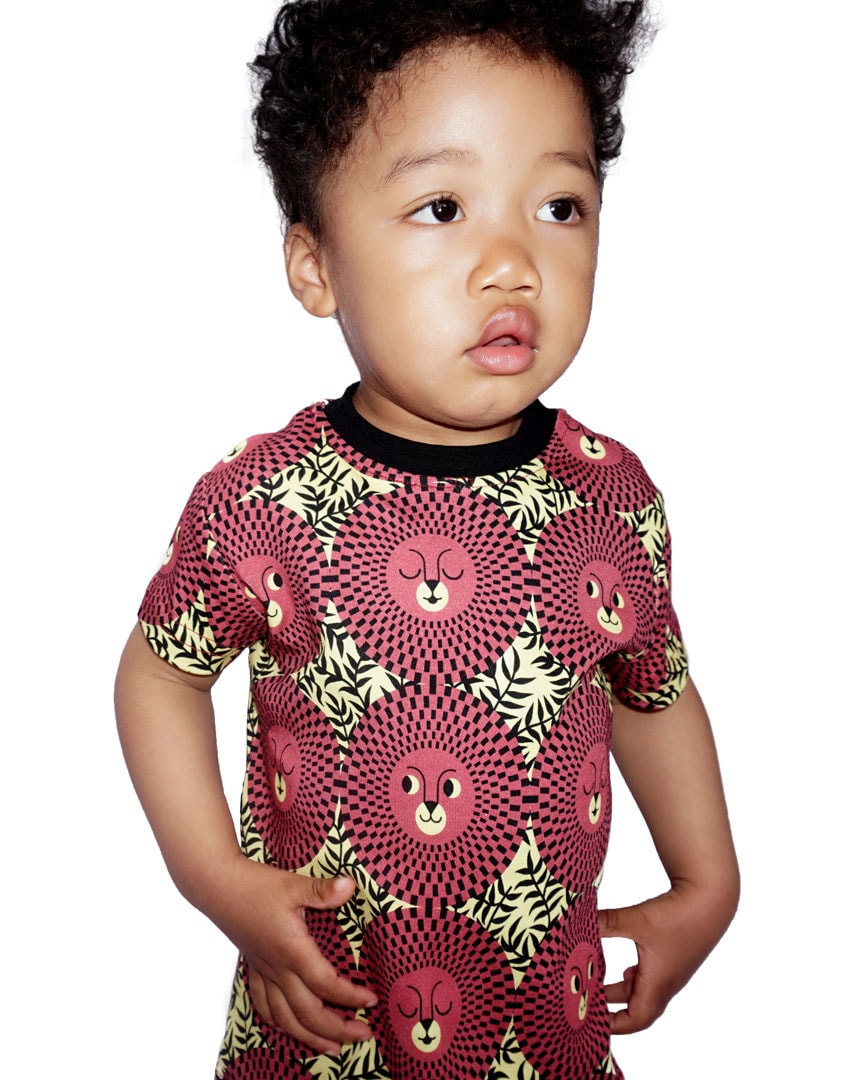 Little boy wearing red/yellow/black African inspired lion face kids t-shirt
